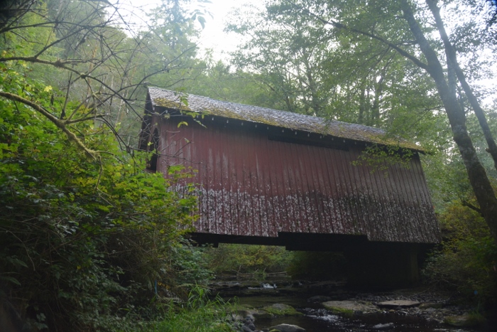 side view of red covered bridge